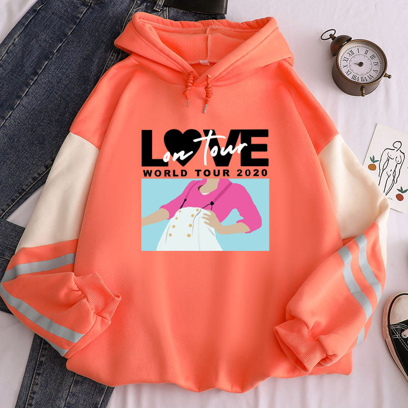 Coral Infinite Celebrations graphic hoodie with message featuring a stylish design and vibrant colors