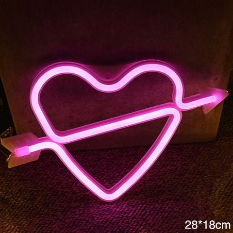 Unique LED night light in pink heart shape with arrow design, perfect for home decor and celebrations